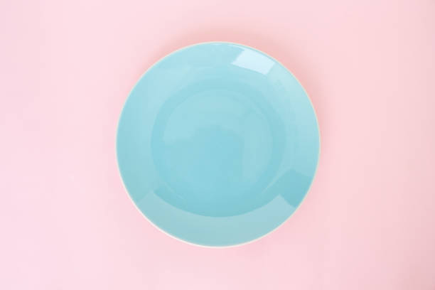 istock blue plate empty on pink rose quartz and serenity background 1031916266