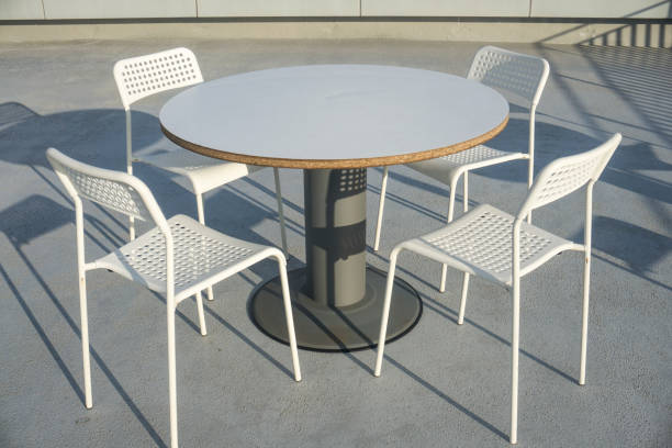 istock steel table and chairs isolated. 1031916294