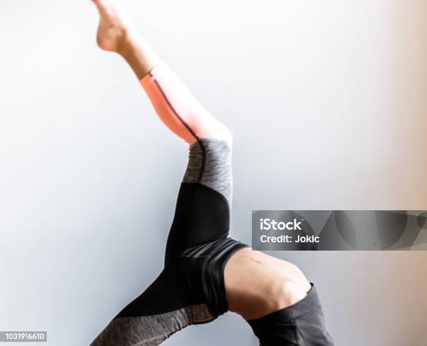 Cropped Ballarina With Raised Up Leg Bridge Pose Camatkarasana Pose One Legged Wheel Pose Stock Photo - Download Image Now