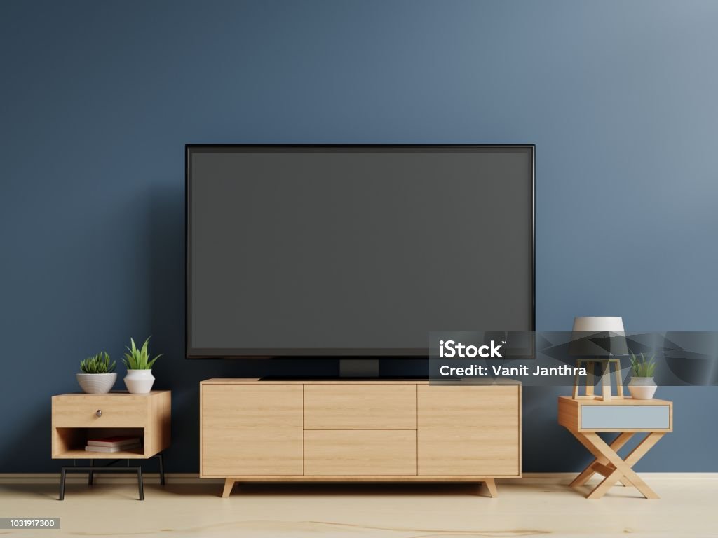 Smart TV on the blue wall in living room Smart TV on the blue wall in living room,3d rendering Living Room Stock Photo