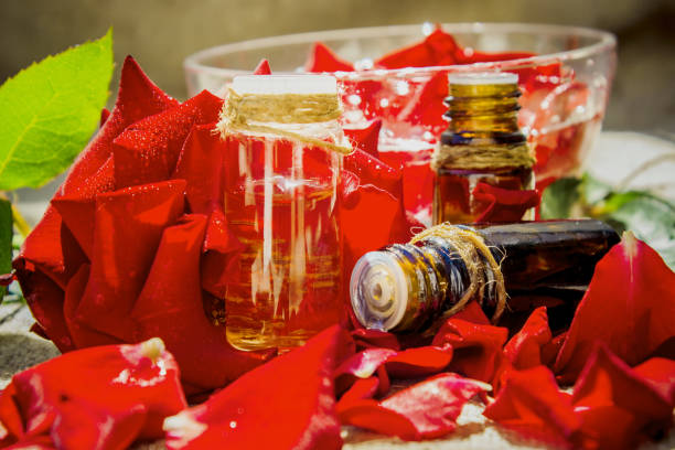 istock rose essential oil in a small jar. Selective focus. 1031920470