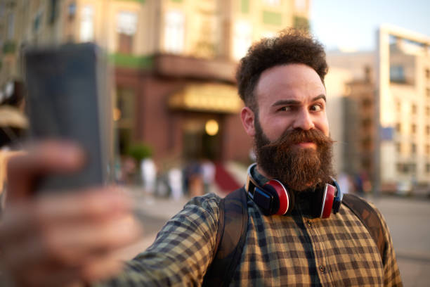 istock Male hipster person takinf selfie image 1031922710