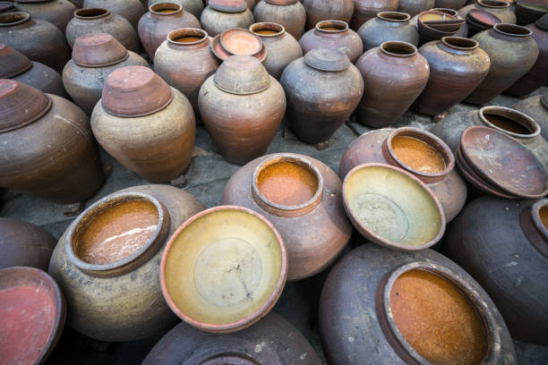 istock Jars of processing soybean jam made by traditional outdoor way under natural sunlight 1031924952
