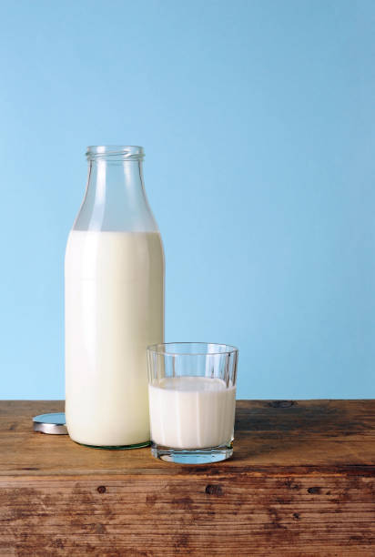 istock Milk bottle and glass with fresh milk 1031925104
