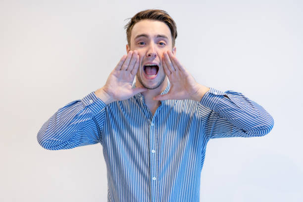 istock Emotional handsome young man screaming loudly 1031928412