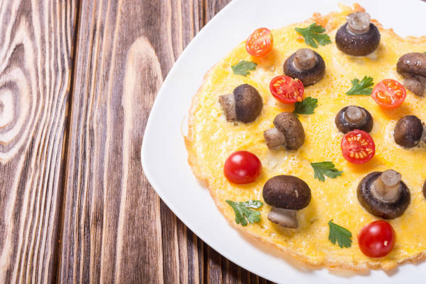 istock Omelette with mushroom , tomato and parsley 1031929128