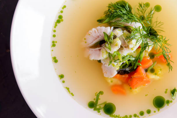 seafood soup in a white plate on a concrete background - main course salmon meal course imagens e fotografias de stock