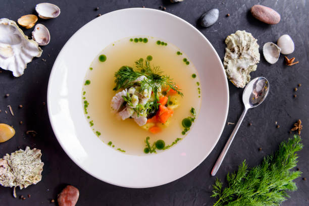 seafood soup in a white plate on a concrete background - main course salmon meal course imagens e fotografias de stock