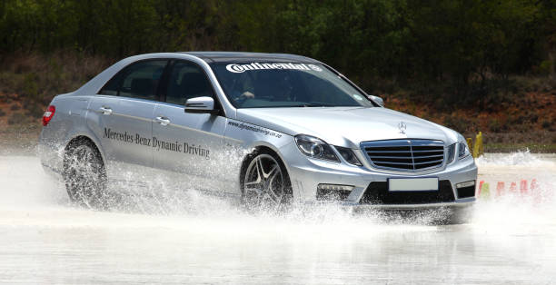 advanced driver training car on skid pan. - driving training car safety imagens e fotografias de stock