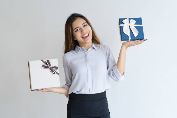 istock Cheerful beautiful woman holding two gift boxes 1031937896