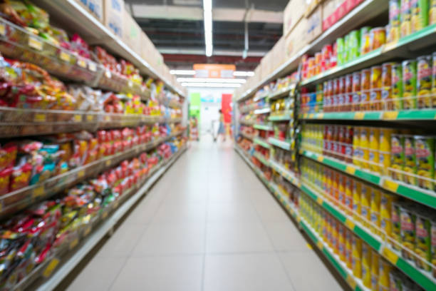 istock Supermarket blurred background with colorful shelves and unrecognizable customers 1031943842