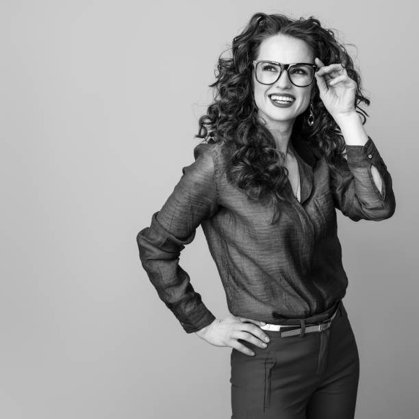 istock woman in glasses on background looking at copy space 1031944610
