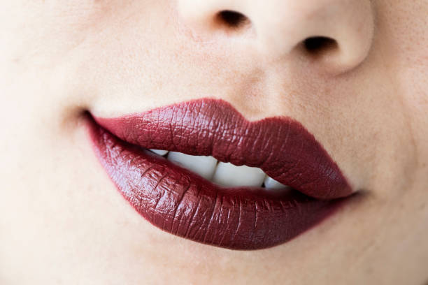 istock Red glossy female lips close up view 1031945284