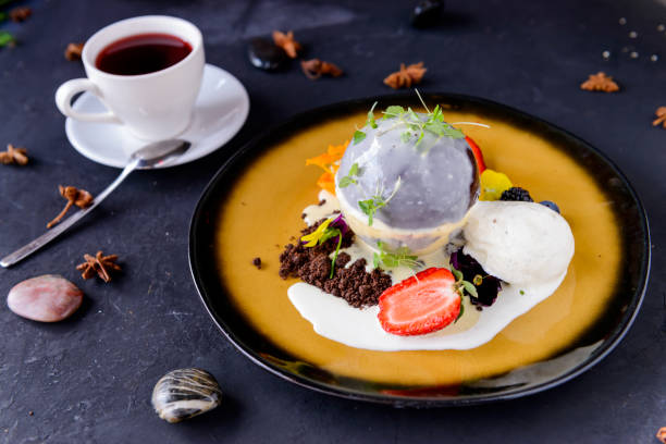istock circles of ice cream with cake on a plate 1031945908