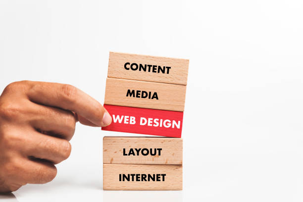 istock Businessman Building WEB DESIGN concept with Wooden Blocks 1031948802