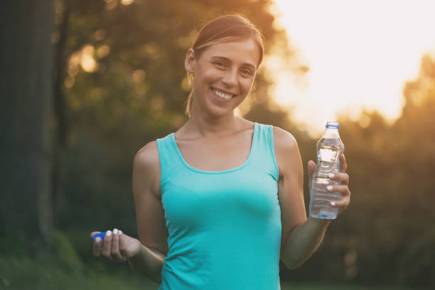 istock Sporty woman  drinking water 1031955436