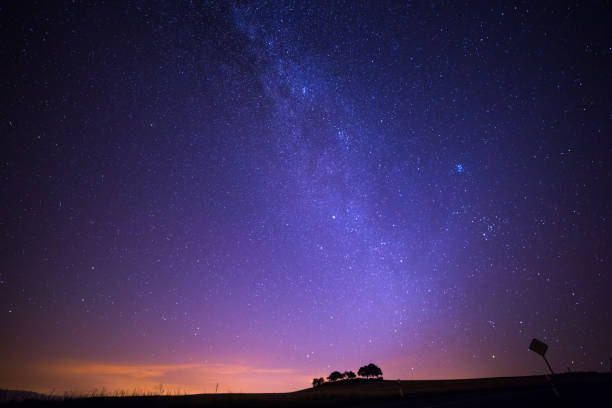 istock Shooting Stars Crossing in Milky Way and Starry Sky before Dawn 1031956756