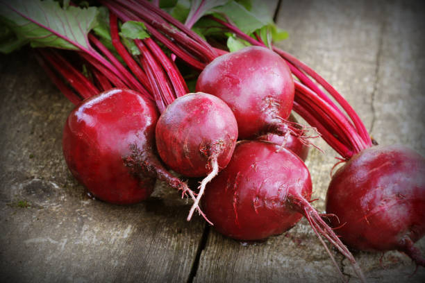 istock Fresh beetroot on rustic wooden background. Harvest vegetable cooking conception . Diet or vegetarian food concept 1031969124
