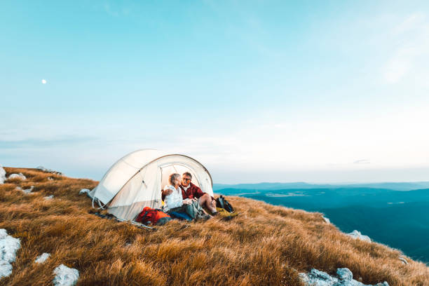 istock Happy senior couple camping in the mountains 1031973210