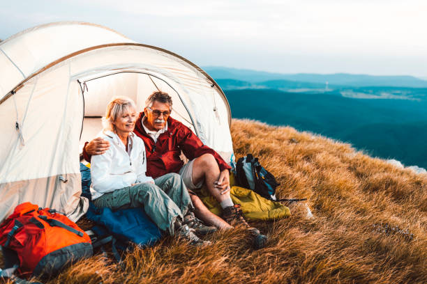 istock Happy senior couple camping in the mountains 1031973236