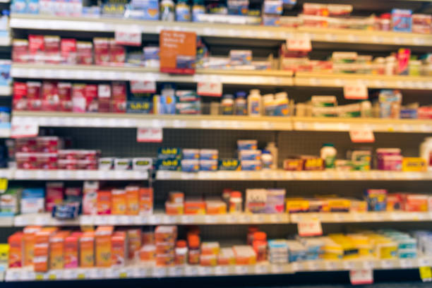 istock Blurry background American pharmacy store with various pharmaceutical and medicines 1031980144