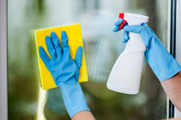 istock Hand in glove washes a window 1031980232