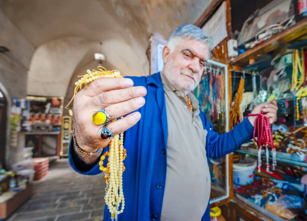 Unidentified man sells different kind of rosaries in old bazaar,Sanliurfa,Turkey.19 July 2018