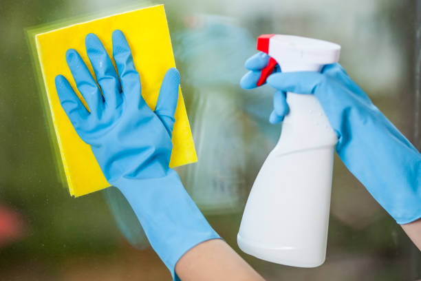istock Hand in glove washes a window 1031980500