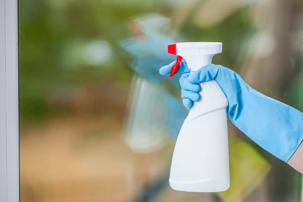 istock Hand in glove washes a window 1031980996
