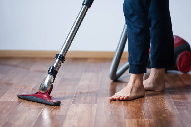 istock woman vacuuming floors 1031981074