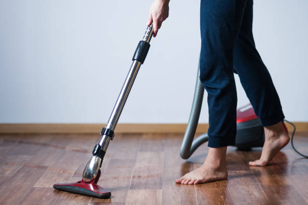 istock woman vacuuming floors 1031981258