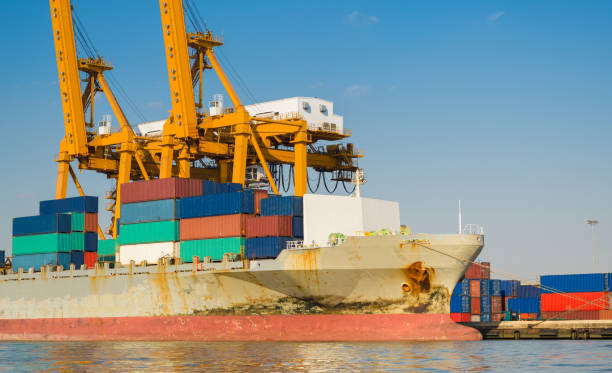 istock Container Cargo freight ship with working crane bridge in shipyard in singapore 1031994540