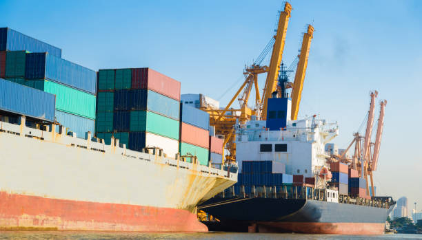 istock Container Cargo freight ship with working crane bridge in shipyard in singapore 1031994684