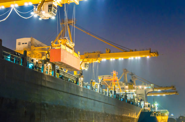 istock Container Cargo freight ship with working crane bridge in shipyard in singapore 1031997678