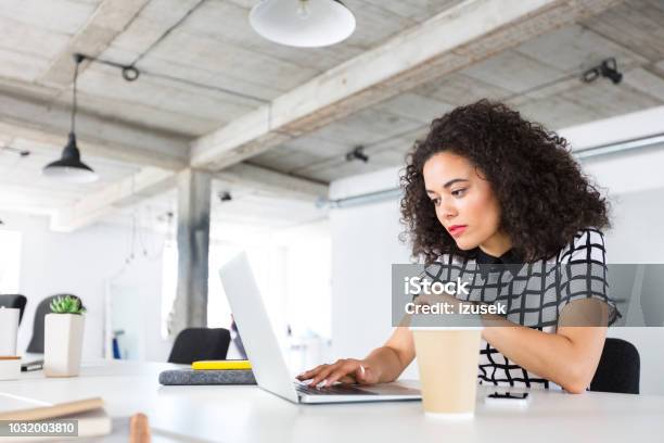 Woman Designer Working On Laptop At Office Stock Photo - Download Image Now - 20-24 Years, Adult, Adults Only
