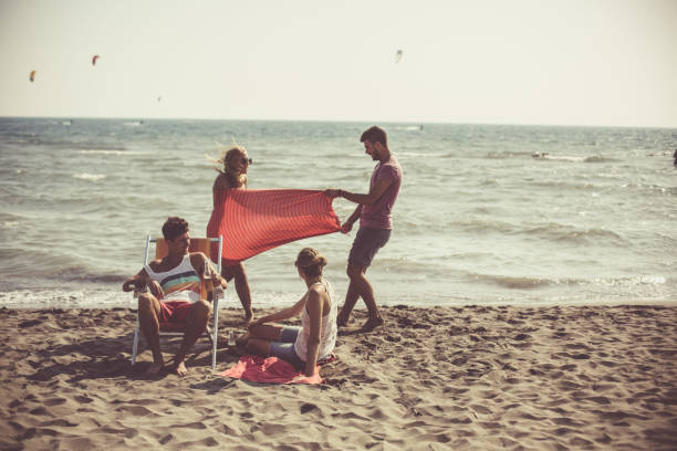 istock Playful couple at the beach 1032018900