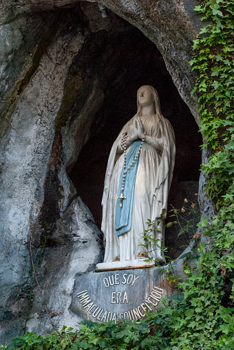 The rock cave at Massabielle with the statue of the Virgin Mary where Saint Bernadette Soubirous claimed to have witnessed Marian apparitions from the Blessed Virgin Mary.