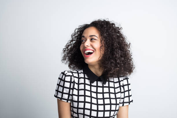 Cute woman looking away and laughing
