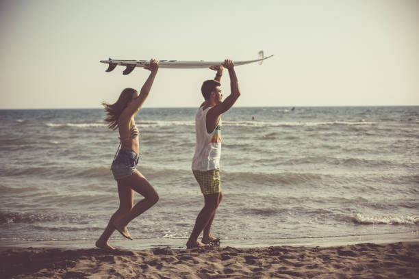 istock Couple on a surf holiday 1032028270