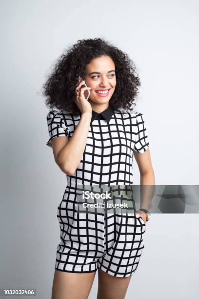 Stylish Woman Talking Over Phone Stock Photo - Download Image Now - 20-24 Years, Adult, Adults Only