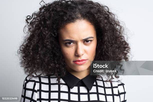Serious Woman Staring At Camera Stock Photo - Download Image Now - 20-24 Years, Adult, Adults Only