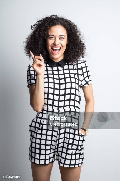 Surprised Woman Showing Copy Space Stock Photo - Download Image Now - 20-24 Years, Adult, Adults Only