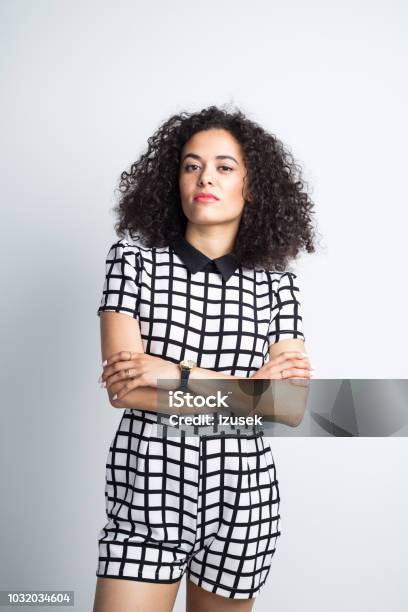 Stylish Young Woman Posing On Gray Background Stock Photo - Download Image Now - 20-24 Years, Adult, Adults Only