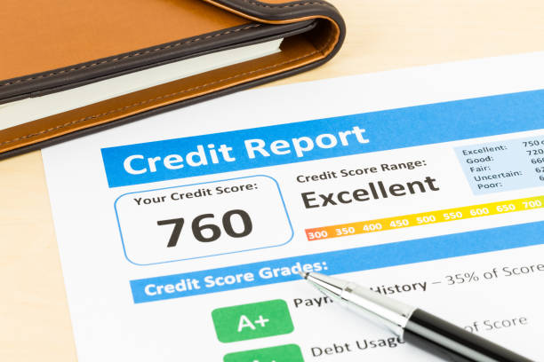 istock Credit score report with pen and organizer book 1032034802