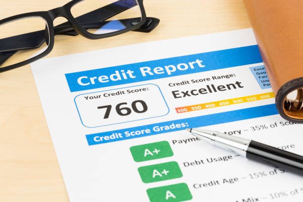 istock Credit score report with pen, glasses, and organizer book 1032034804