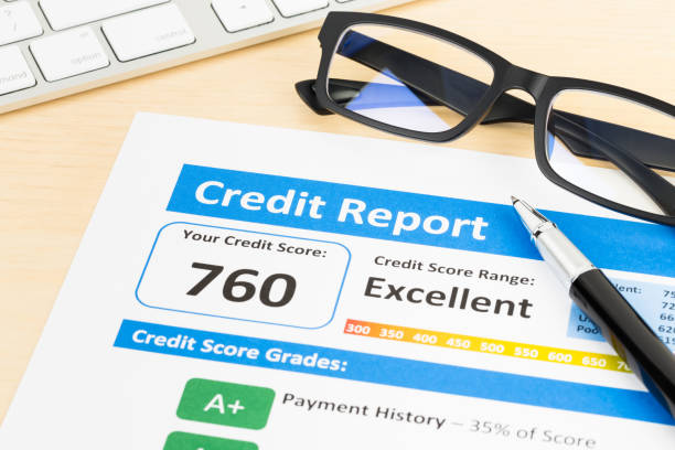 istock Credit score report with keyboard, glasses, and pen 1032034844