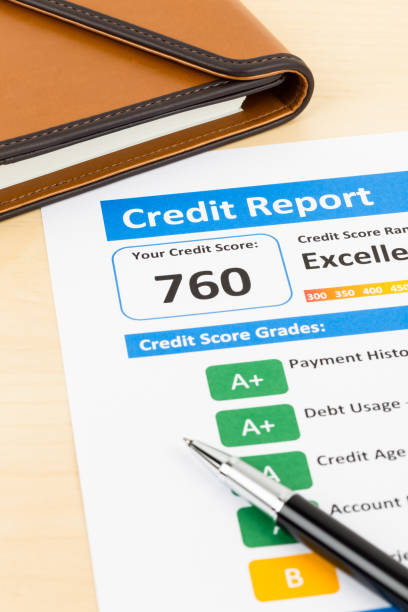 istock Credit score report with pen and organizer book 1032034850