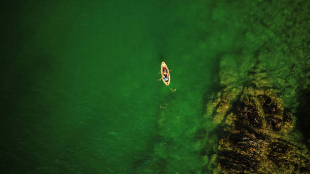 istock People canoeing along the coast 1032039726