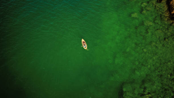 istock People canoeing along the coast 1032039930