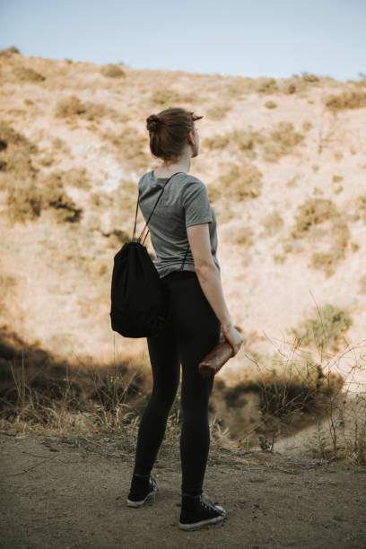 istock Woman trekking in the valley 1032040536